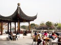 People having luch on the waterfront in ancient Suzhou water town