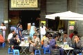 People having lunch or a snack at a typical vietnamese street restaurant in Hoi An