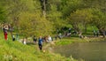 People having a picnic, taking photo, lying on grass and having a good time on the shore of Lake Golcuk | Golcuk Golu. Royalty Free Stock Photo