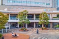 People having rest in the inner courtyard of the typical living node building in Tokyo, Japan