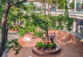 People having rest in the inner courtyard of the typical living node building in Tokyo, Japan