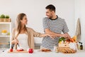 Happy couple cooking food at home kitchen Royalty Free Stock Photo