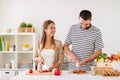 Happy couple cooking food at home kitchen Royalty Free Stock Photo