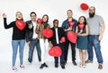 People with heart shaped balloons