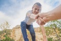 People helping each other hike up a mountain, Giving a helping h Royalty Free Stock Photo