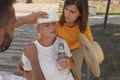 People helping woman on city street. Suffering from heat stroke Royalty Free Stock Photo