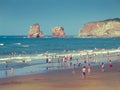 People on Hendaye beach in France, the Twins rocks Royalty Free Stock Photo