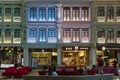 People in the heritage zone inside terminal 4 of Changi airport . Architectural details of colorful facade of building in Royalty Free Stock Photo