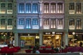 People in the heritage zone inside terminal 4 of Changi airport . Architectural details of colorful facade of building in Royalty Free Stock Photo