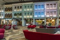 People in the heritage zone inside terminal 4 of Changi airport . Architectural details of colorful facade of building in Royalty Free Stock Photo