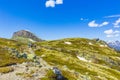 People hikers and mountain at Hydnefossen waterfall river Hemsedal Norway