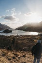 People hiking in Glenfinnan, Scotland, Glenfinnan Monument on th