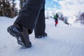 People hiking on snow path in winter time Royalty Free Stock Photo