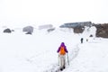 People hiking on snow trail towards base camp Royalty Free Stock Photo