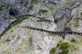 People at hiking trail through Austrian mountains to ice cave Royalty Free Stock Photo