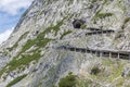 People at hiking trail through Austrian mountains to ice cave Royalty Free Stock Photo