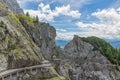 People at hiking trail through Austrian mountains to ice cave Royalty Free Stock Photo