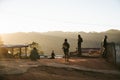 People are on the hill when the sun is going down at golden hour in the Akha village of Maejantai on the hill in Chiang Mai.