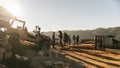 People are on the hill when the sun is going down with Jeep car on the left side in the Akha village of Maejantai on the hill.