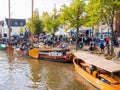 People and historic boats in old harbour during event Admiralty Days, Dokkum, Friesland, Netherlands Royalty Free Stock Photo