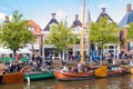 People and historic boats in old harbour during event Admiralty Days, Dokkum, Friesland, Netherlands Royalty Free Stock Photo