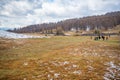 People on historic Kurgan or tumulus, grave mound in Tschuja Steppes, Altai Republic, Siberia, Russia