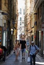 People on Historic Narrow Pedestrian Street Via del Campo, Genoa, Italy.