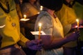 People hold candles light at night Royalty Free Stock Photo