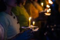 People hold candles light at night Royalty Free Stock Photo