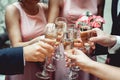 People hold in hands glasses with white wine. wedding party. Royalty Free Stock Photo