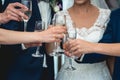 People hold in hands glasses with white wine. wedding party. Royalty Free Stock Photo