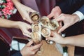 People hold in hands glasses with white wine. wedding party. Royalty Free Stock Photo