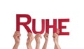 People Hold Straight German Word Ruhe Means Rest Royalty Free Stock Photo