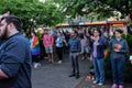 People hold up lit candles for Orlando victims during Corvallis, Oregon vigil