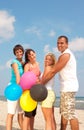 People holding balloons in CMYK colors Royalty Free Stock Photo