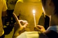 People holding candle vigil in darkness seeking hope, worship, p Royalty Free Stock Photo