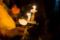 People holding candle vigil in darkness seeking hope, worship, p Royalty Free Stock Photo