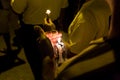 People holding candle vigil in darkness seeking hope, worship, p Royalty Free Stock Photo