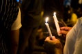 People holding candle vigil in darkness seeking hope, worship, p Royalty Free Stock Photo