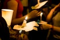 People holding candle vigil in darkness seeking hope, worship, p Royalty Free Stock Photo