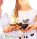 People holding glasses of red wine making a toast Royalty Free Stock Photo