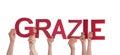 People Holding Grazie Royalty Free Stock Photo