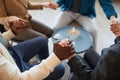 People Holding Hands in Support Group Background