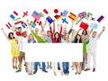 People Holding International Flags and Placard Royalty Free Stock Photo