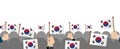 People holding the national flag in hand , vector banner illustration / South korea