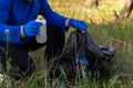 People holding a plastic garbage bottle put in a garbage bag for cleaning Royalty Free Stock Photo