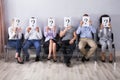 People Holding Question Mark Sign