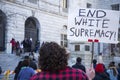 People holding signs supporting Asians in order to protest against the white supremacy in Portland Maine