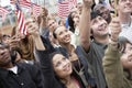 People Holding Up American Flags