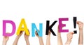 People holding word DANKE! Royalty Free Stock Photo